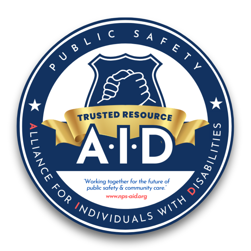 NPS-AID Trusted Resource seal featuring a handshake icon inside a badge, the text Public Safety Alliance for Individuals with Disabilities, and the motto Working together for the future of public safety and community care.